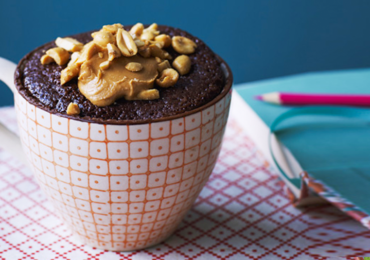 Chocolate cake in a mug with peanut butter