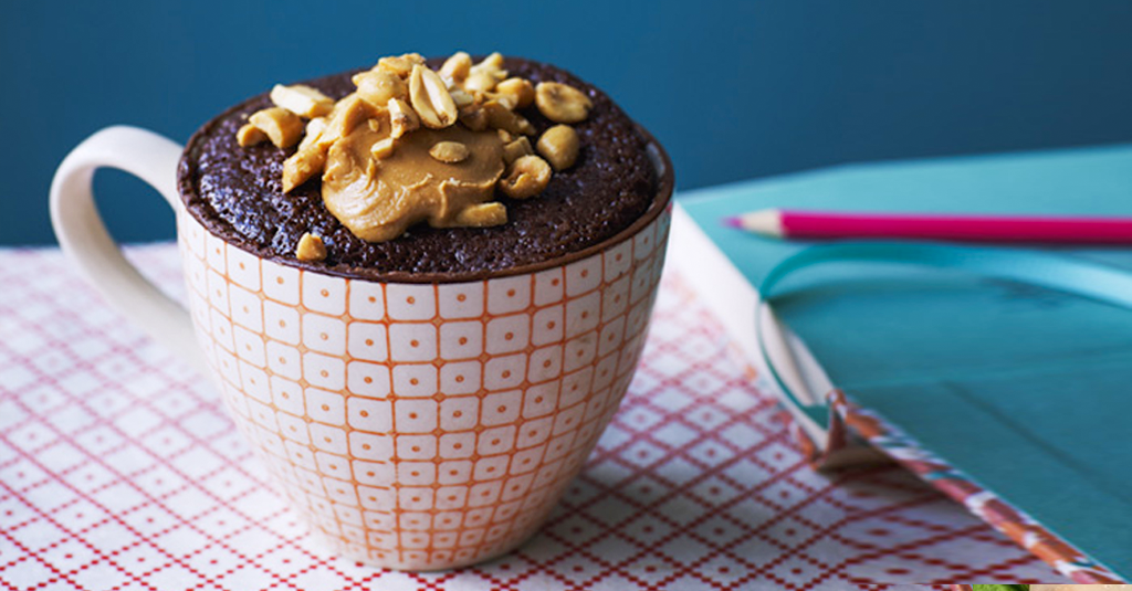 Chocolate cake in a mug with peanut butter